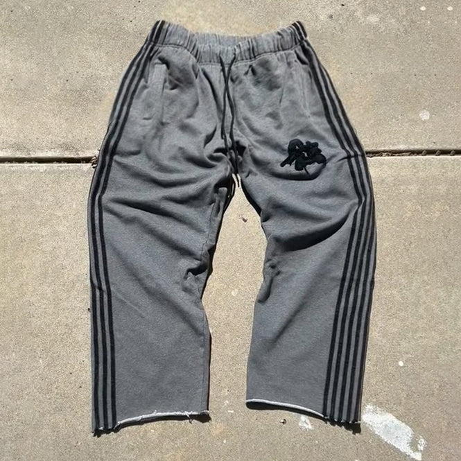 Appliqué striped casual trousers